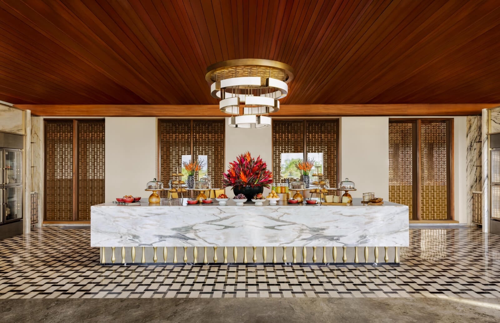 Elegant Regent Club lounge with a curved bar and intimate seating at Regent Bali Canggu